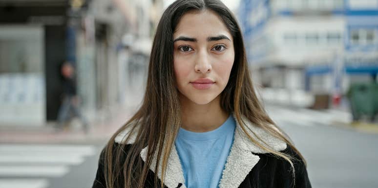 young woman with facial tell of narcissist
