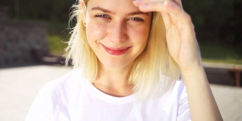 Woman smiling slightly coy showing why certain affirmations are shockingly effective even for skeptics