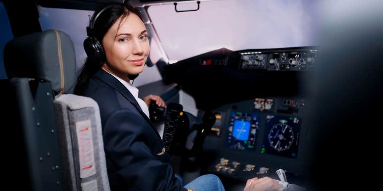 female pilot in plane cockpit