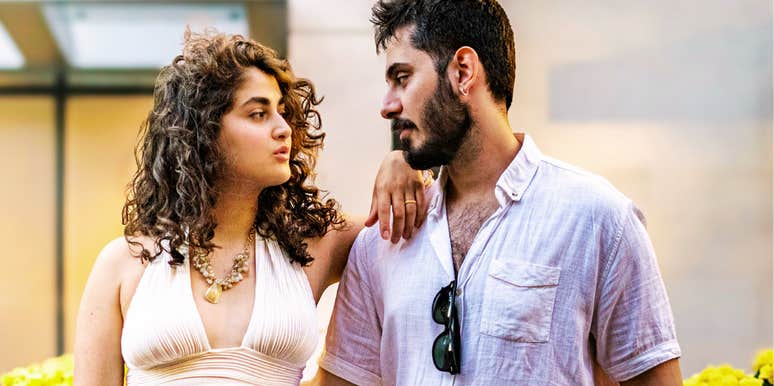 Couple looking at each other while finding a compromise showing the art of social compromise and ways extroverts can stay married to introverts.