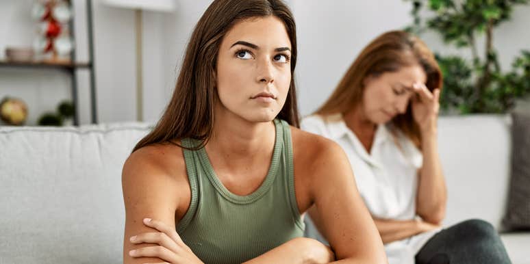 young woman getting defensive to criticism from mom