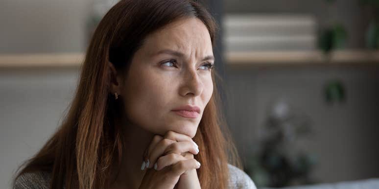 sad woman thinking while hearing background noise