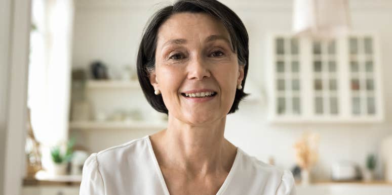 older woman with morals sitting in her kitchen