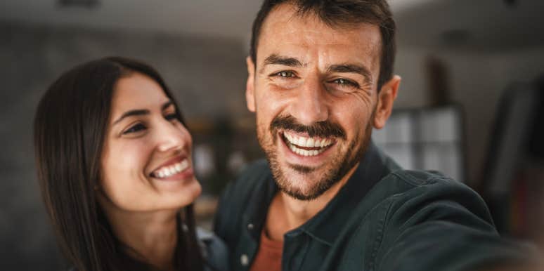 happy couple smiling taking a selfie