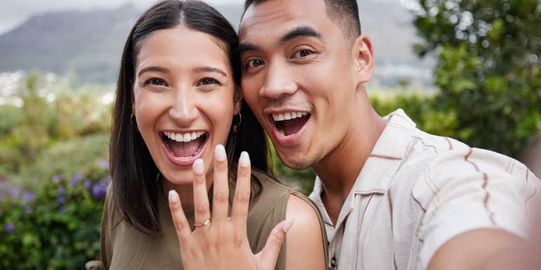 engaged couple showing off ring