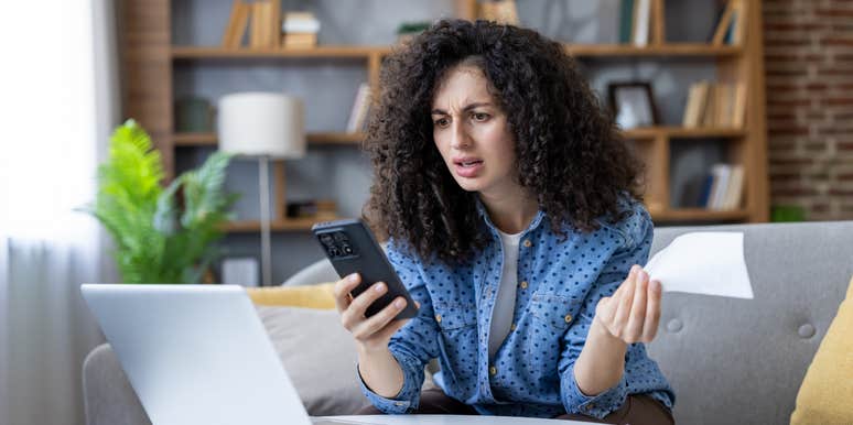 stressed woman looking at finances