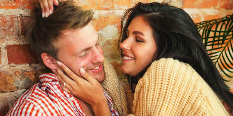 happy relaxed couple talking comfortably and laughing together, illustrating the simple everyday conversations healthy couples share to build lasting happiness