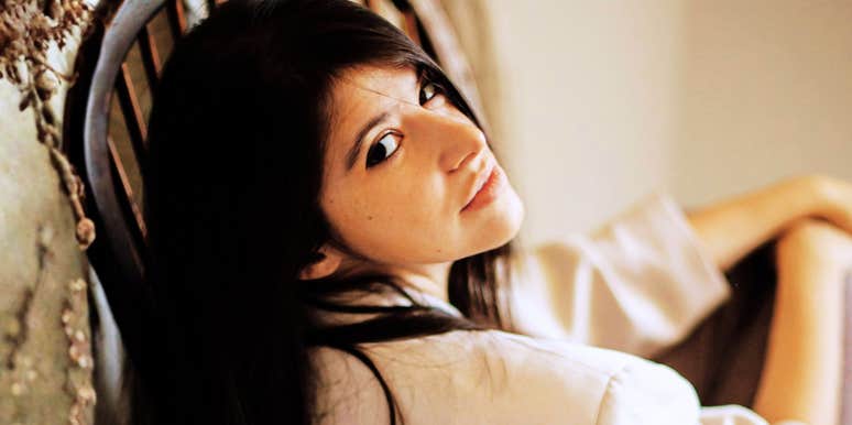 Woman resting back with a tired but steady expression, capturing the quiet determination it takes to keep going when you’re honestly over it.