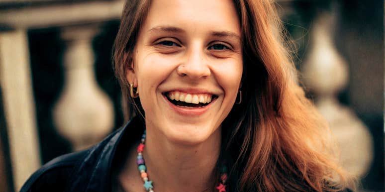 bright upbeat person radiating warm positive energy, illustrating the simple daily habits of people who never give off that heavy Debbie-downer vibe