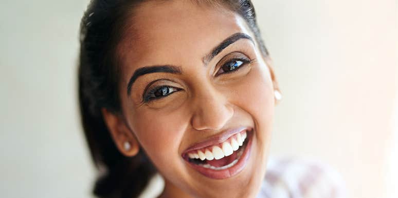 Woman is unbothered and truly happy.