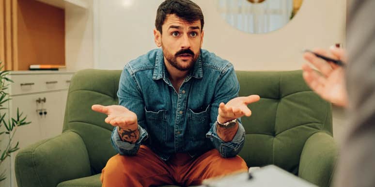 Man making a confession in therapy to a couples counselor 