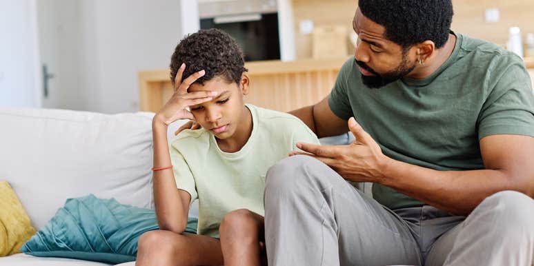 dad having serious conversation with his teen son