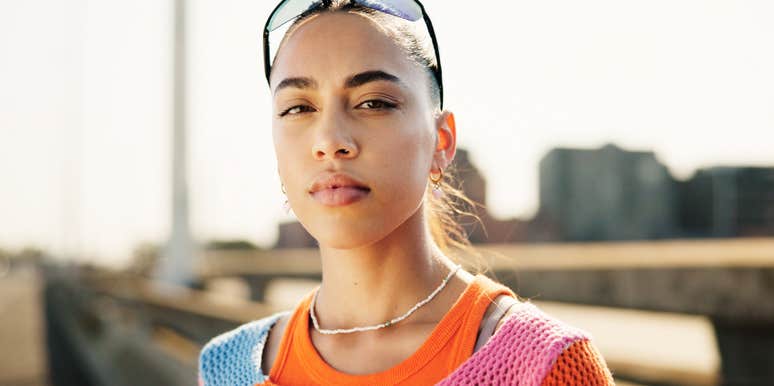 young adult woman staring off serious