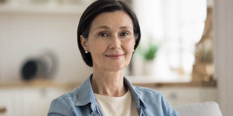 woman sitting on couch looking at camera