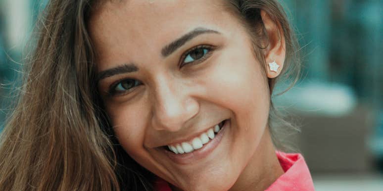 Woman is happy and unbothered.