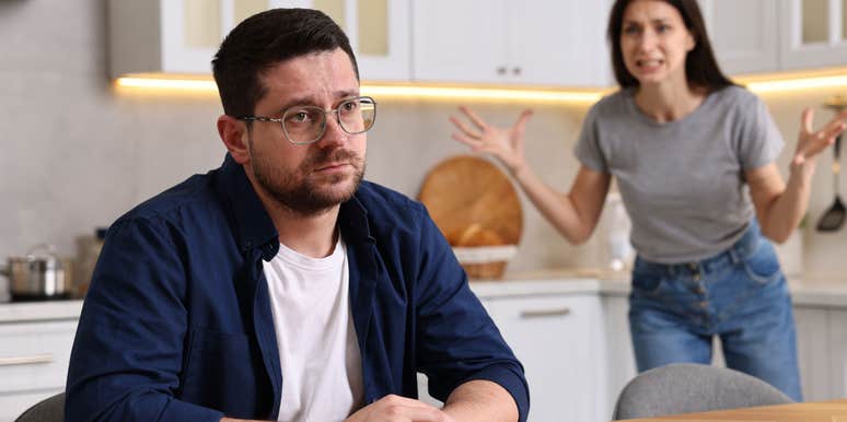 unhappy sad man thinking while wife is upset