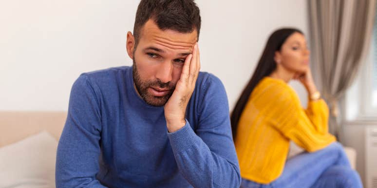 sad husband turned away from wife he doesn't trust