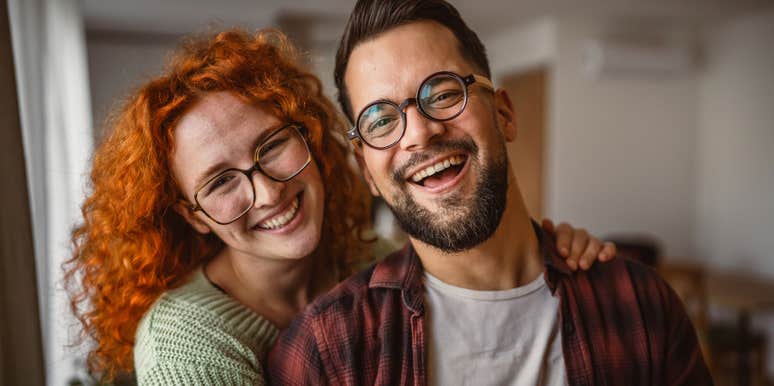 good man smiling next to his happy wife
