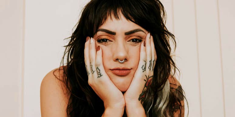 heartbroken person sitting alone, capturing the painful truths that surface when you love someone who refuses to commit