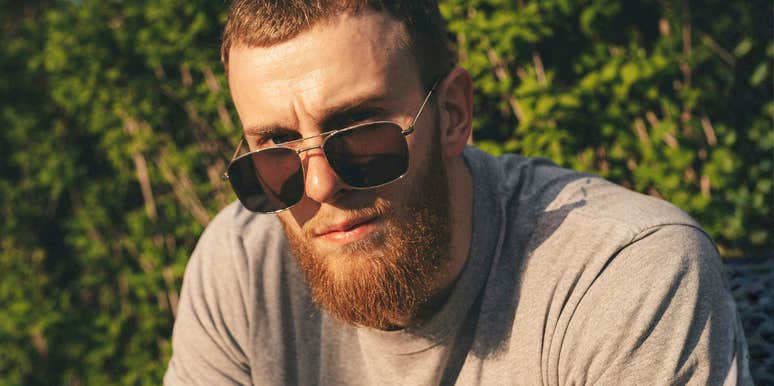 clingy man staring intensely with needy energy, capturing the early clingy behaviors men show when they treat someone like their emotional life raft