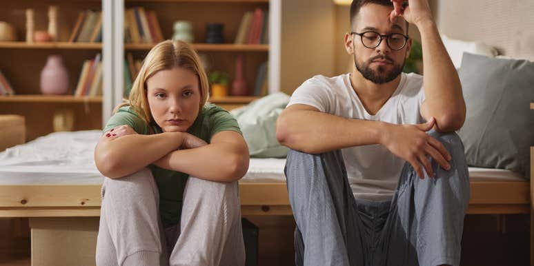 emotionally distant couple sitting next to each other