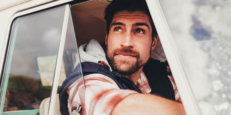 Successful man driving calmly and looking ahead, always true to himself 