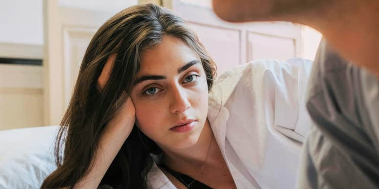 person staring off with quiet dread while their partner feels emotionally distant, capturing the subtle early signs people notice when they kinda know their relationship is already ending