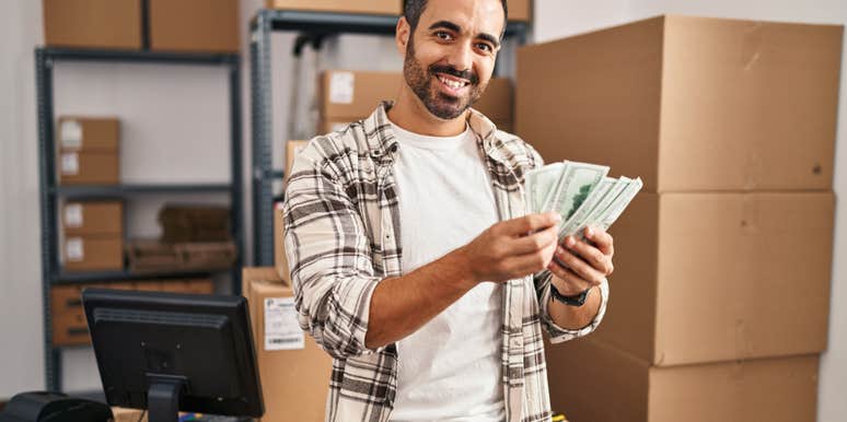 man holding up money