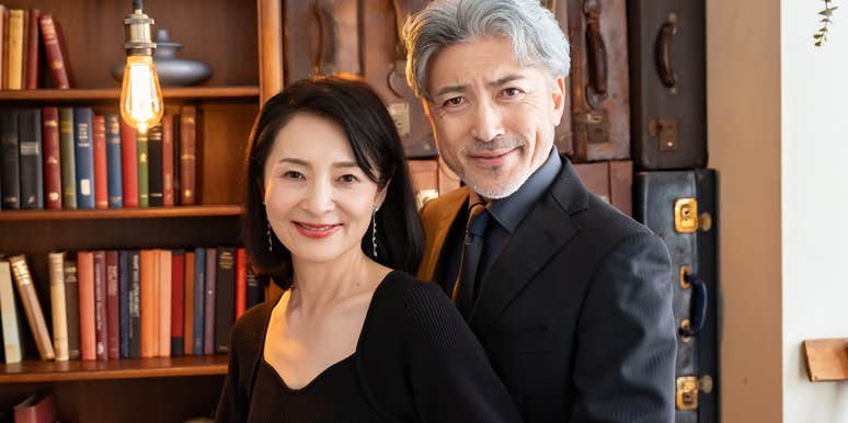 upper class wealthy people standing in big study