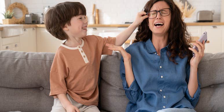 kid annoying his mom