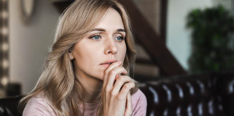 woman sitting at home struggling in silence