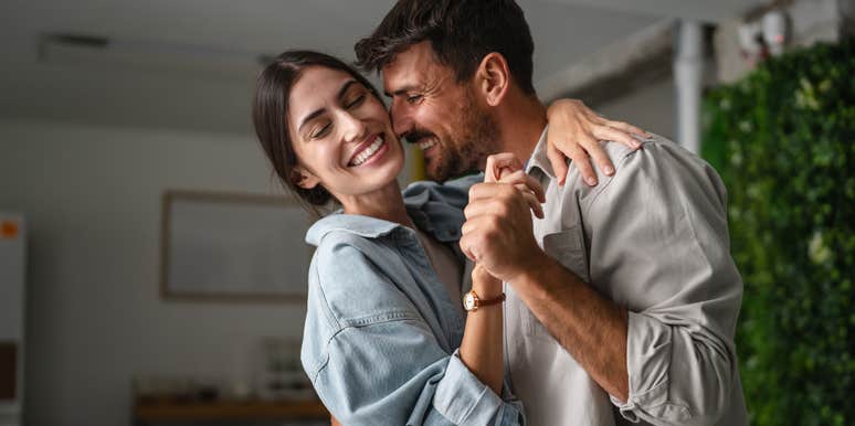sweet couple dancing together deeply in love