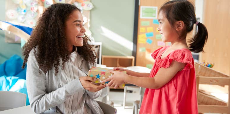 child giving teacher a gift