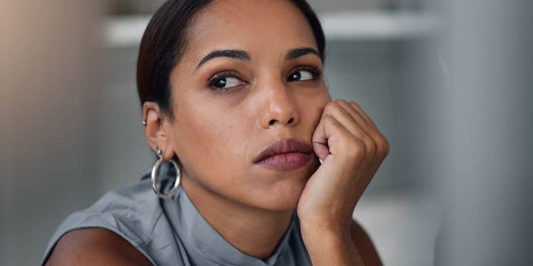 sad professional woman at work suffering from career trauma