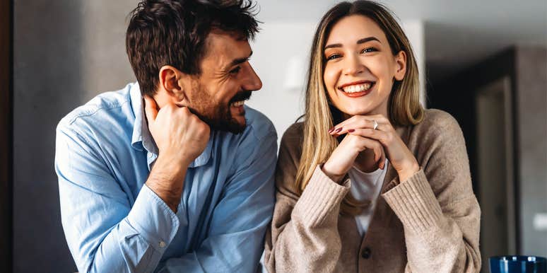 man looking lovingly at wife smiling