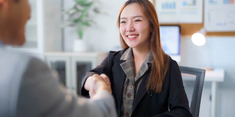 woman getting hired during job interview