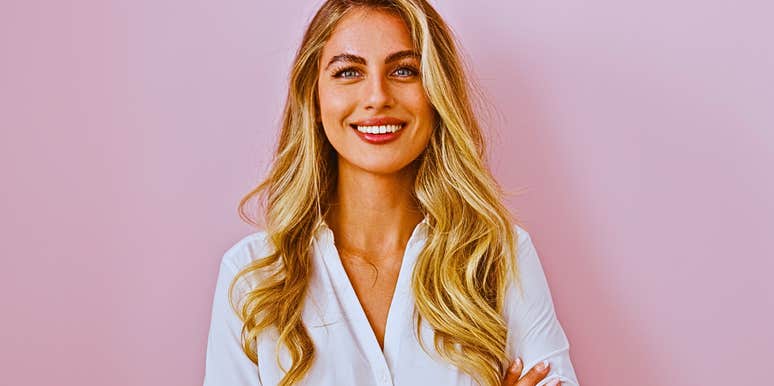 Classy woman with arms crossed is confident in a rare way 