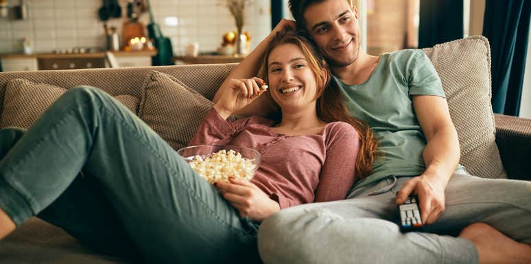 couple watching movie on couch