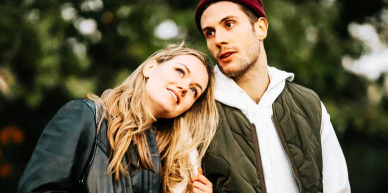 Woman leans on the shoulder of a man she values in life 