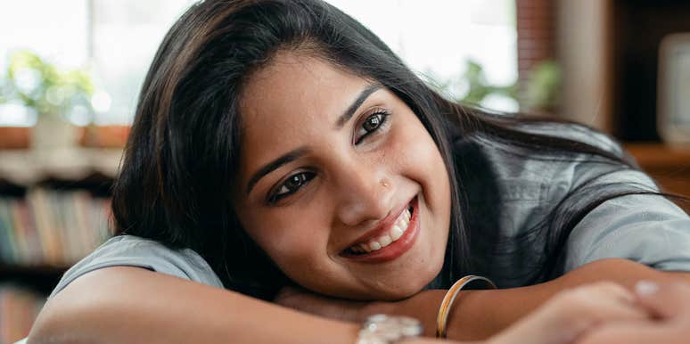 Woman has obvious habits that show she is in love.