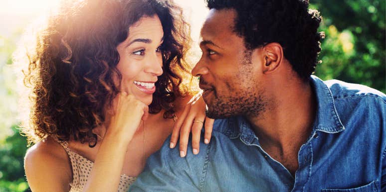 emotionally connected couple leaning in close and smiling during a calm, healthy relationship conversation