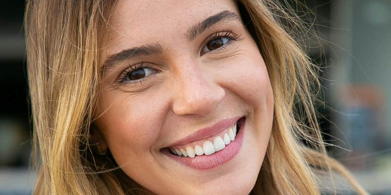 Woman is with a good man who tries to make her smile.