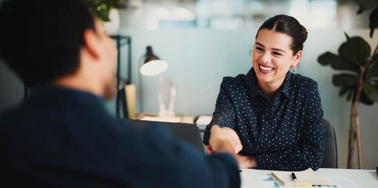 employee shaking manager's hand during job interview