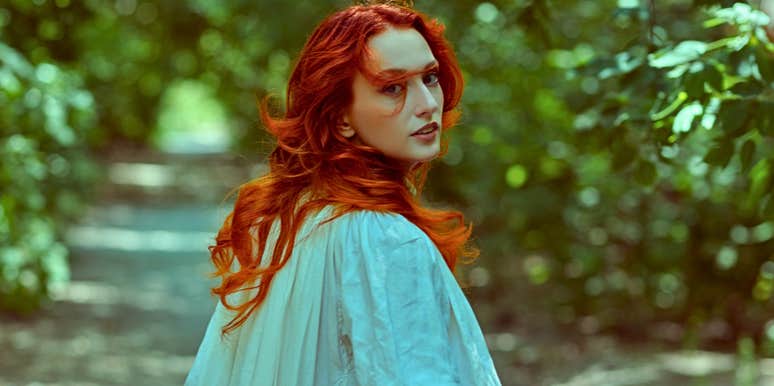 Woman who lacks true integrity walking in the woods