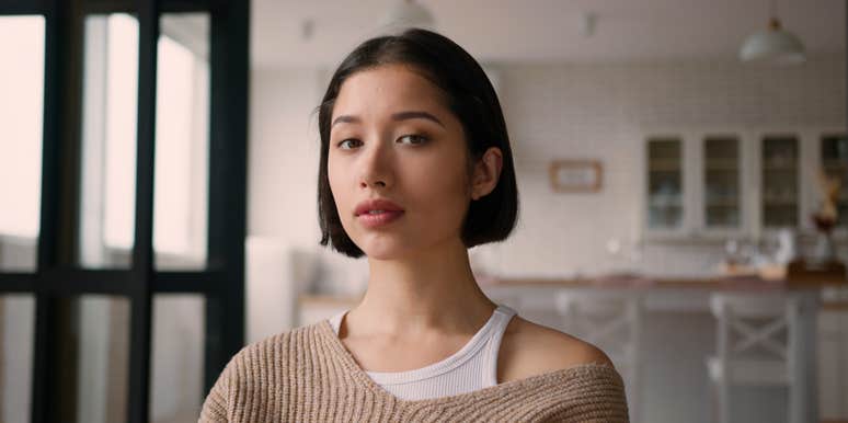 portrait of woman standing in house
