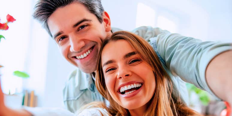 man taking a selfie with woman he truly loves