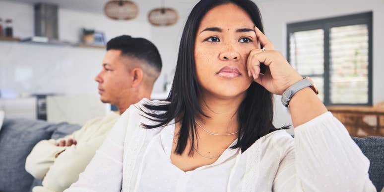 smart woman annoyed with parenting her lazy husband
