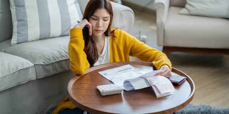 frustrated woman who can't pay her bills because of AI