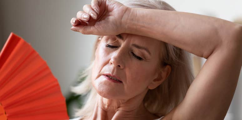 Woman has menopause symptoms.