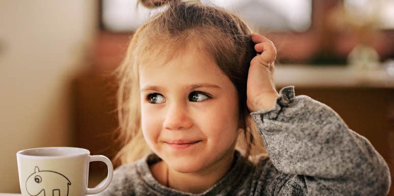Young girl smiling gently, illustrating the quiet strength that can develop in kids raised to choose kindness even when it’s difficult